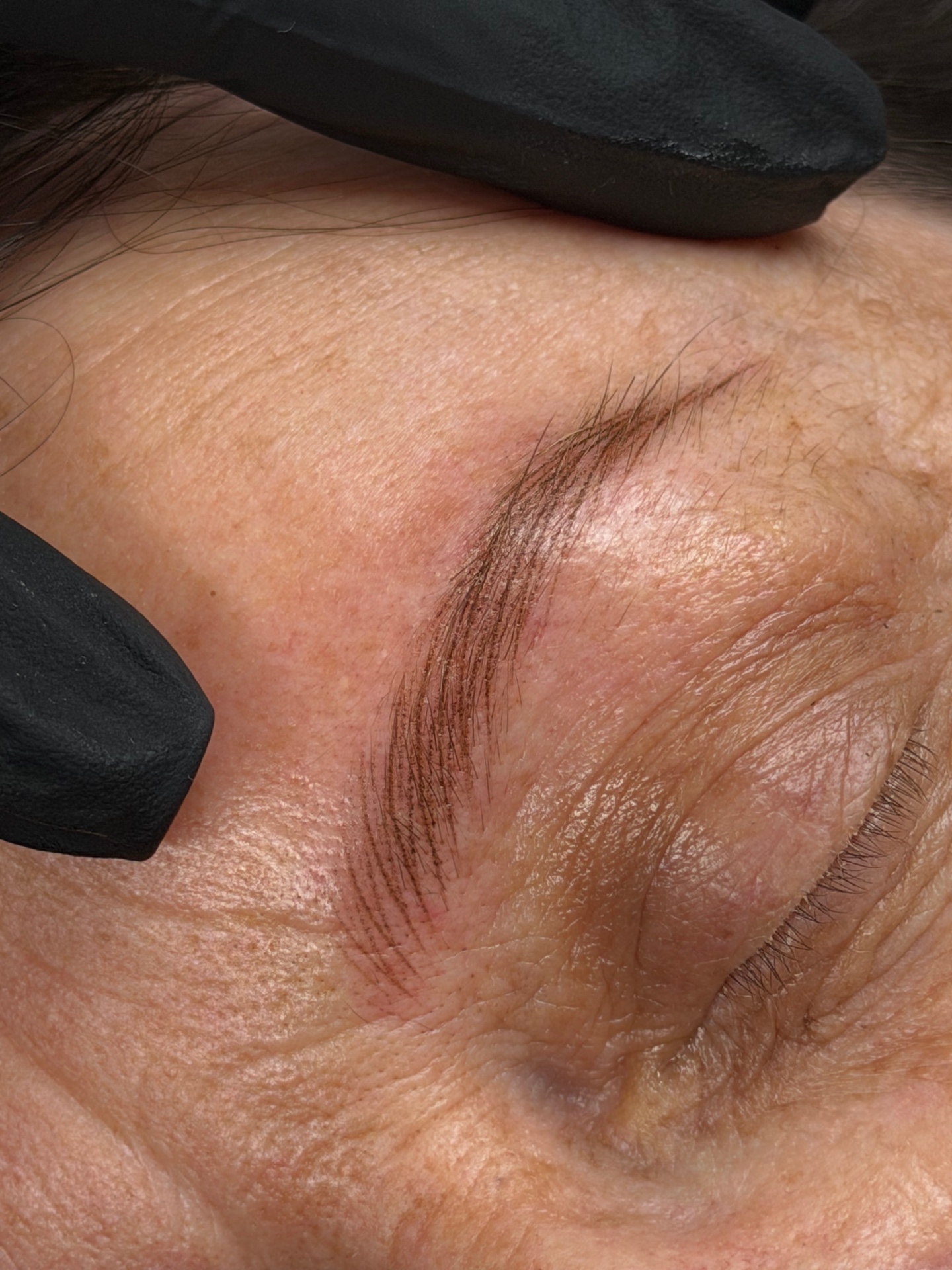 Close-up of natural nano brow hairstrokes