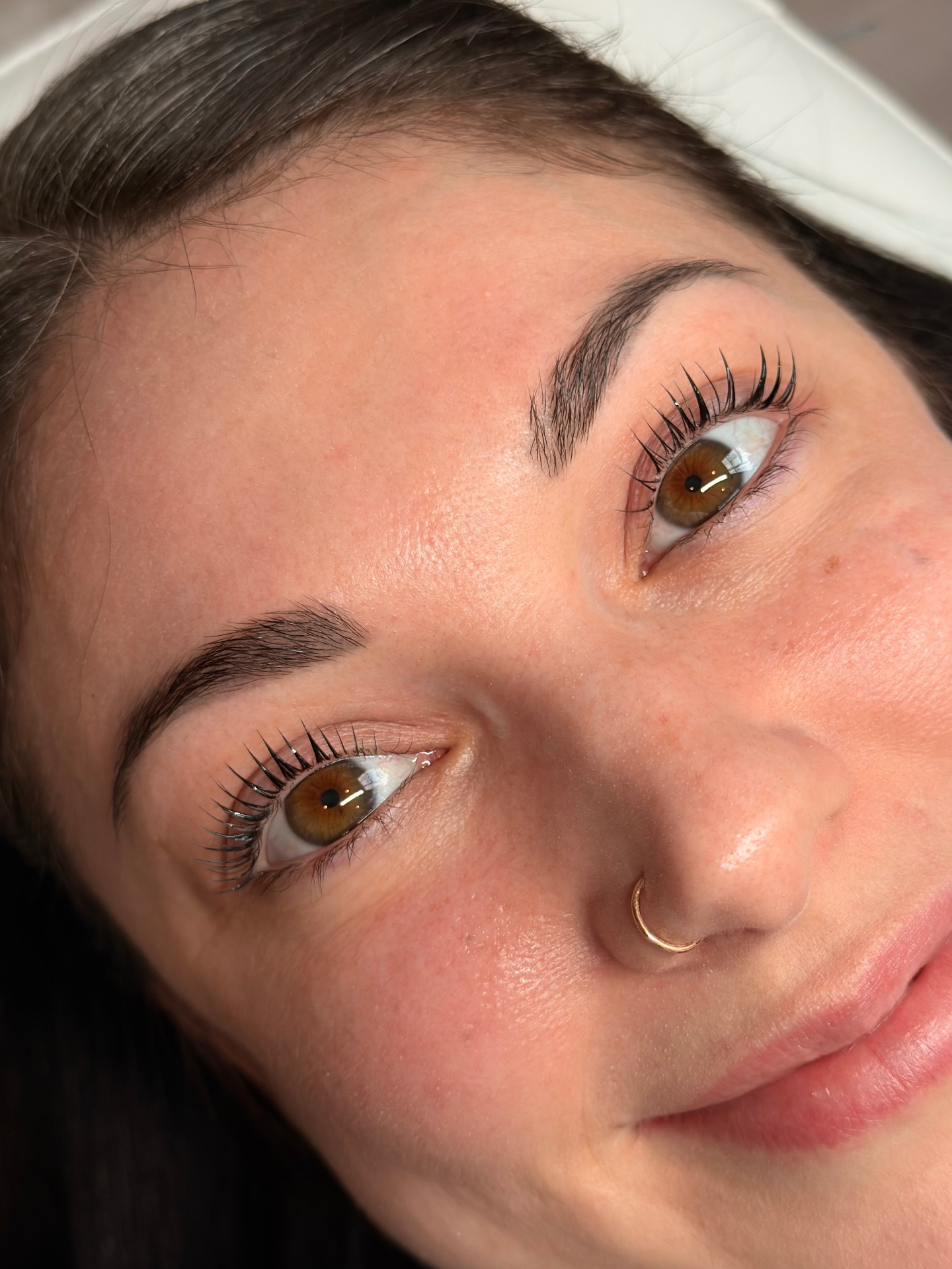 Close-up of a lash lift and tint result with natural brows